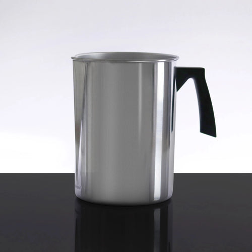 Stainless steel pitcher with a black handle on a reflective surface